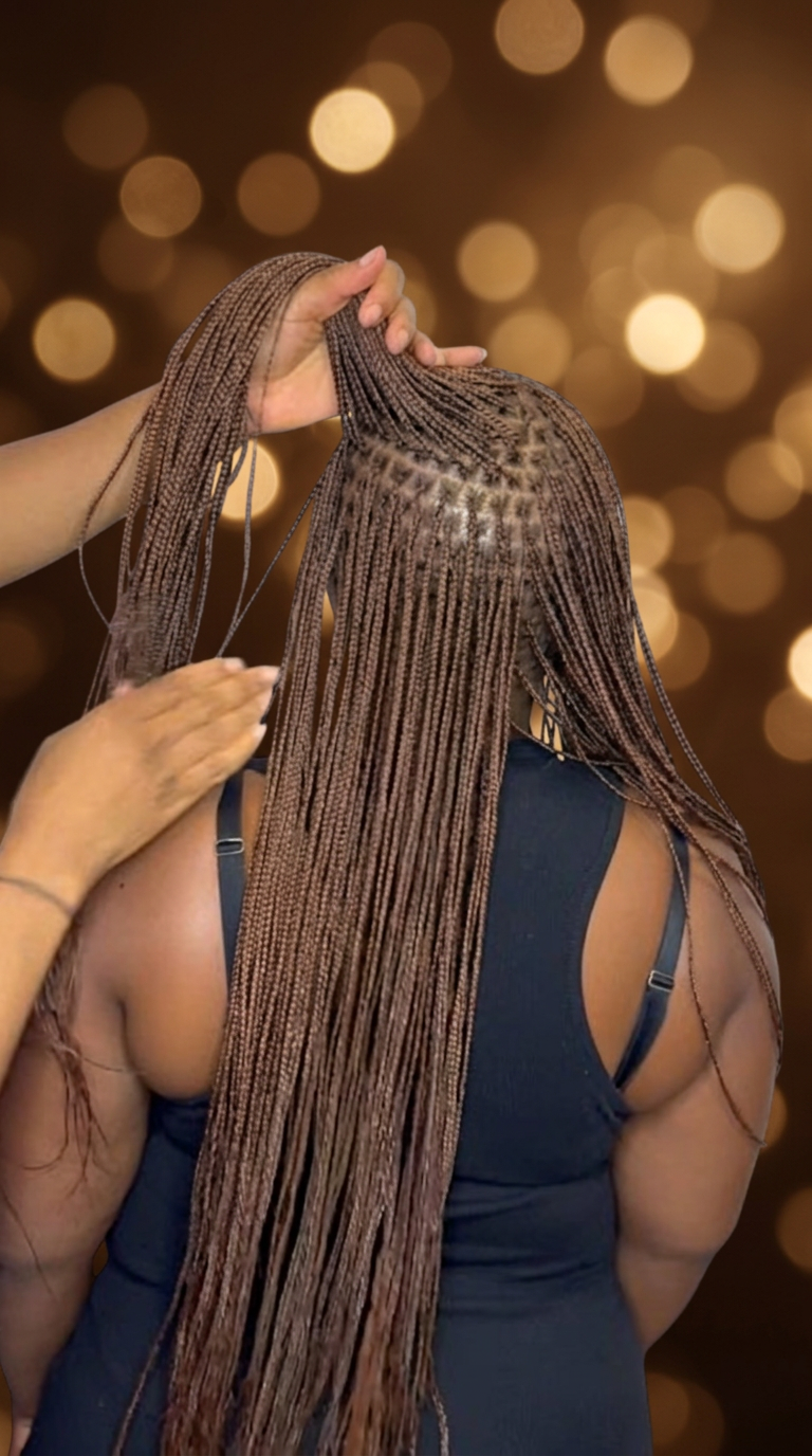 Knotless Braids styled at Precious Hair Braiding