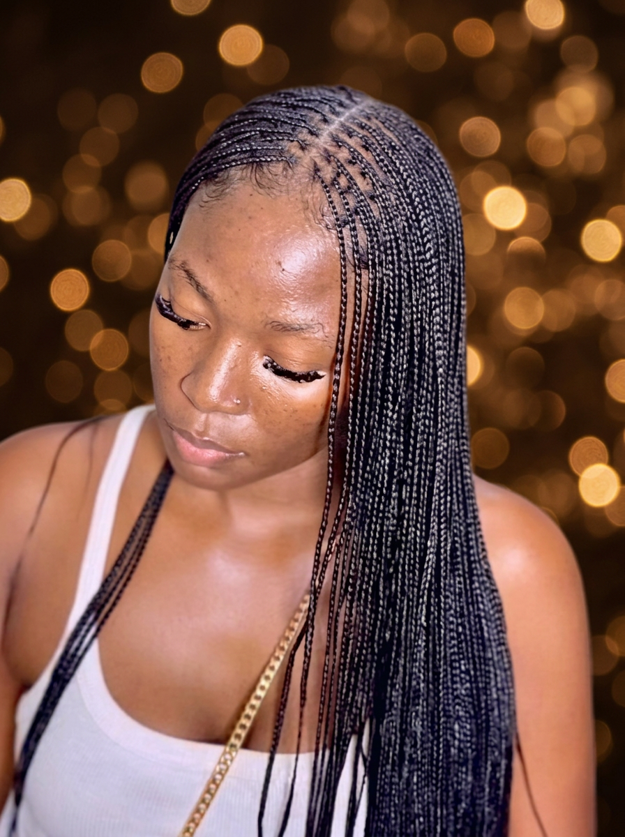 Single Braids styled at Precious Hair Braiding